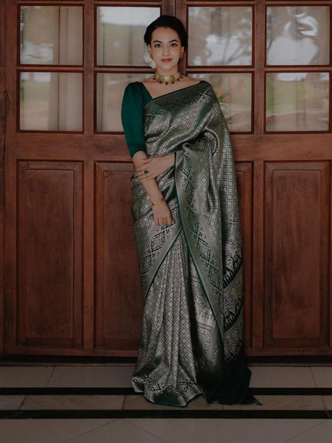 

Mitera Green Ethnic Woven Design Zari Saree