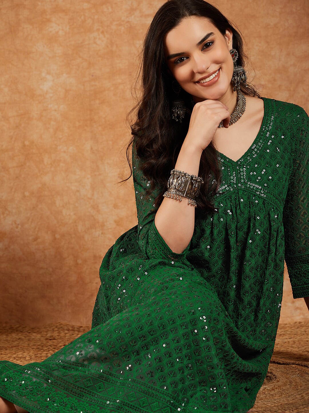 

Sangria Green Ethnic Motifs Embroidered V-Neck Sequinned Empire A-Line Kurta