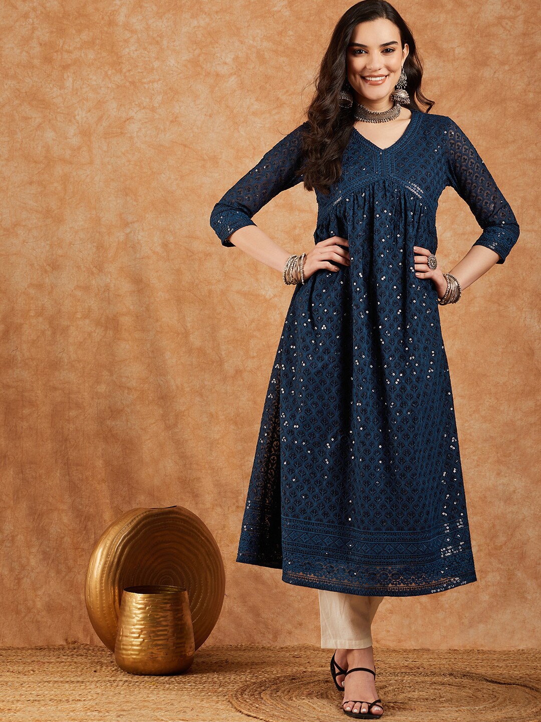 

Sangria Navy Blue Ethnic Motifs Embroidered V-Neck Sequinned Empire A-Line Kurta