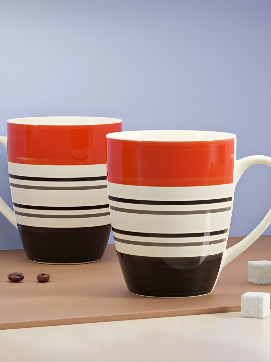 

The Earth Store Orange 2 Pcs Printed Microwave Safe Glossy Finish Ceramic Mugs 280 ml Each