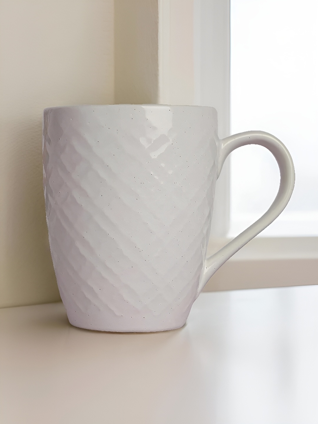

The Earth Store White Textured Microwave Safe Glossy Finish Ceramic Mug 360 ml