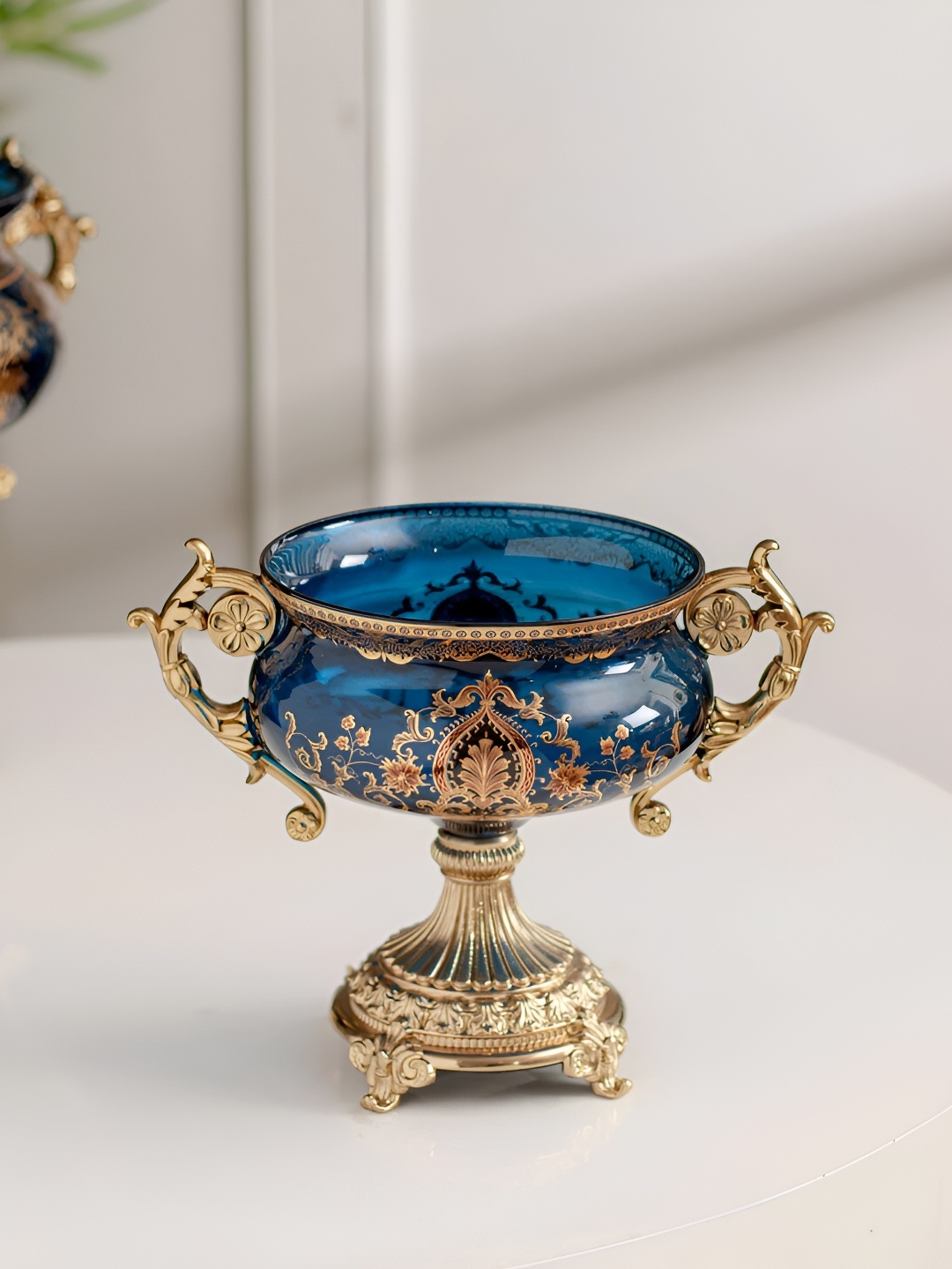 

THEDECORKART Blue & Gold Toned Printed Glass Curio Showpiece