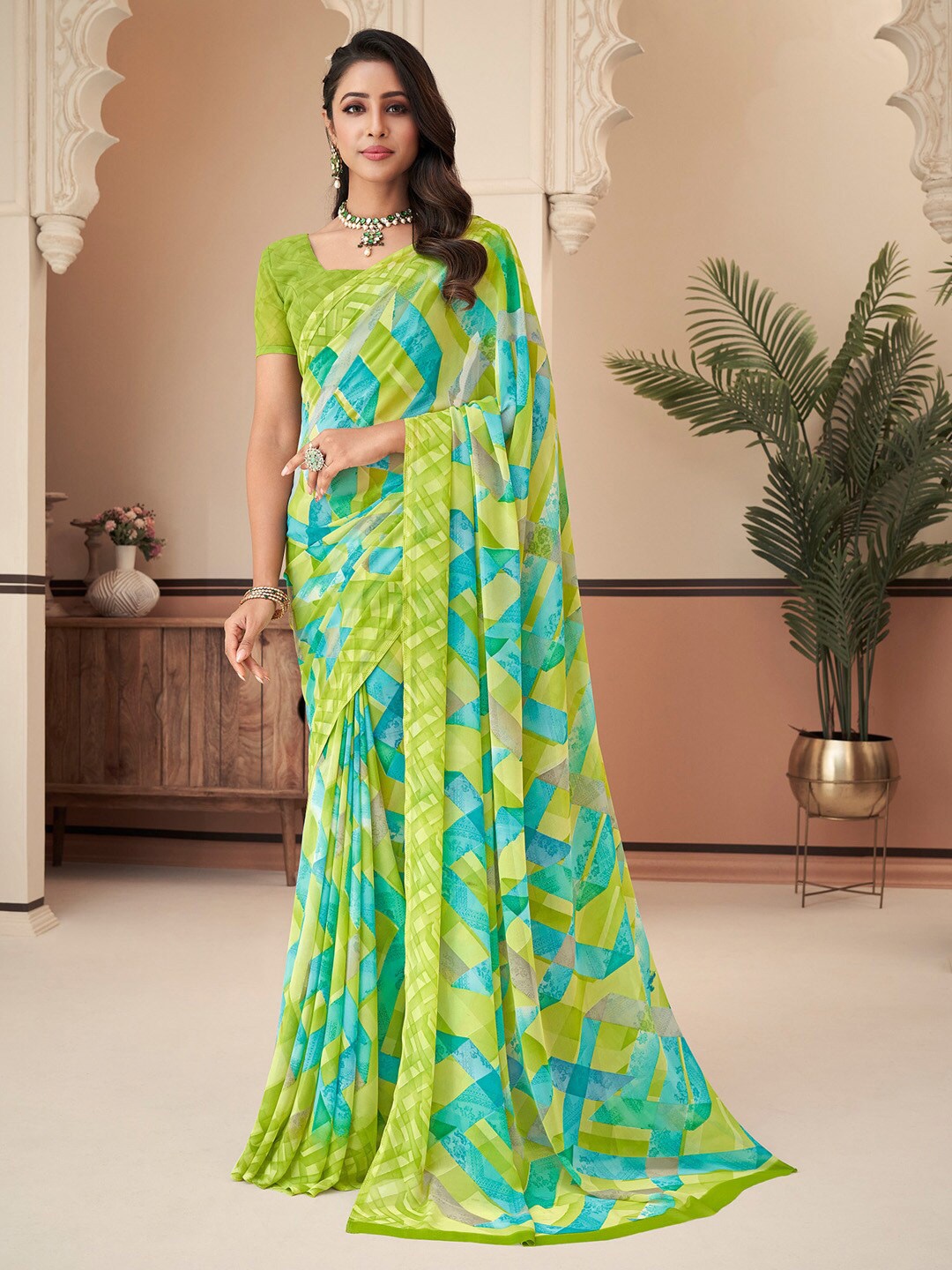 

Anouk Green & Blue Printed Pure Georgette Designer Dabu Saree