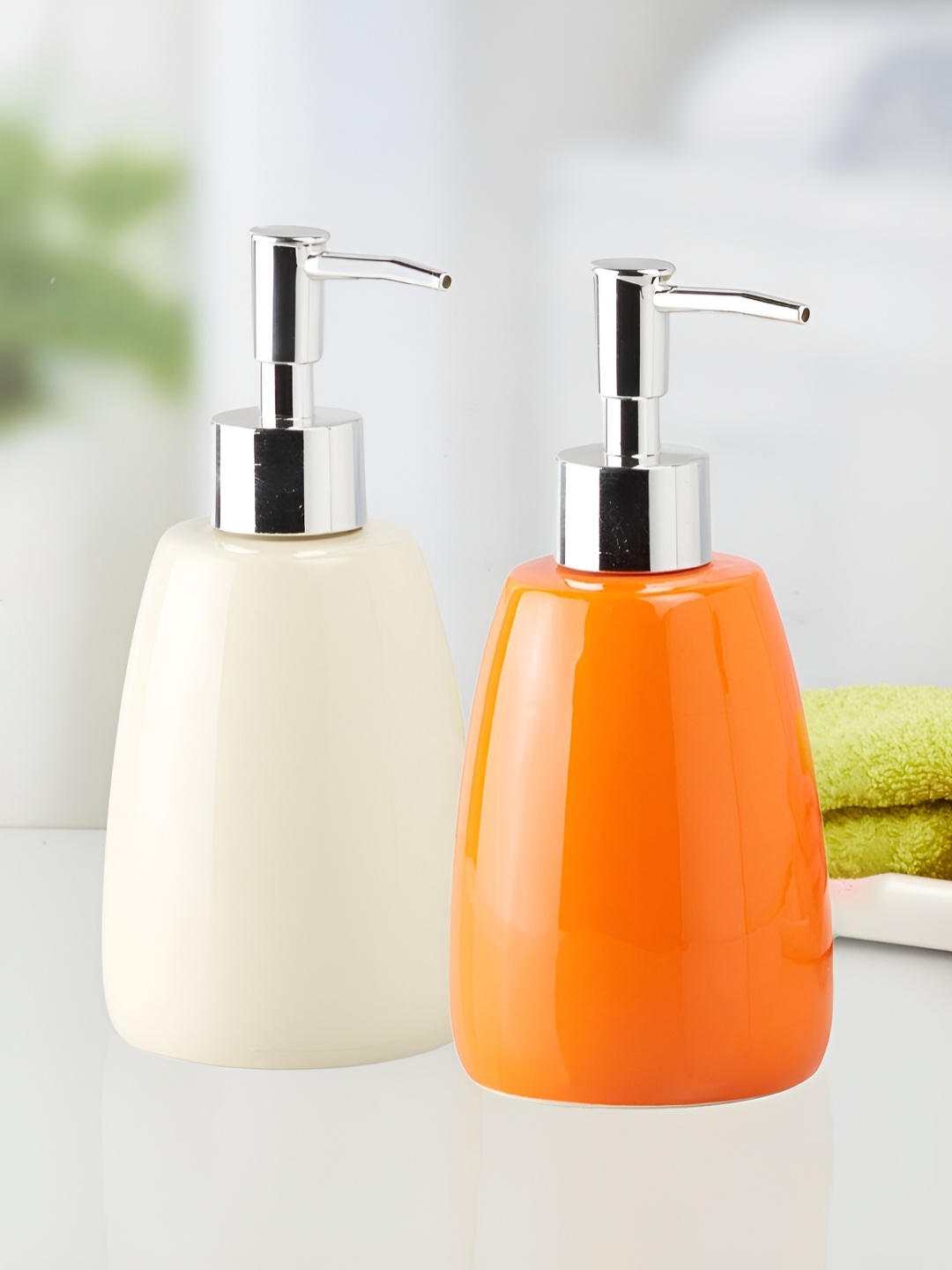 

Kookee White & Orange 2 Pieces Ceramic Soap Dispensers