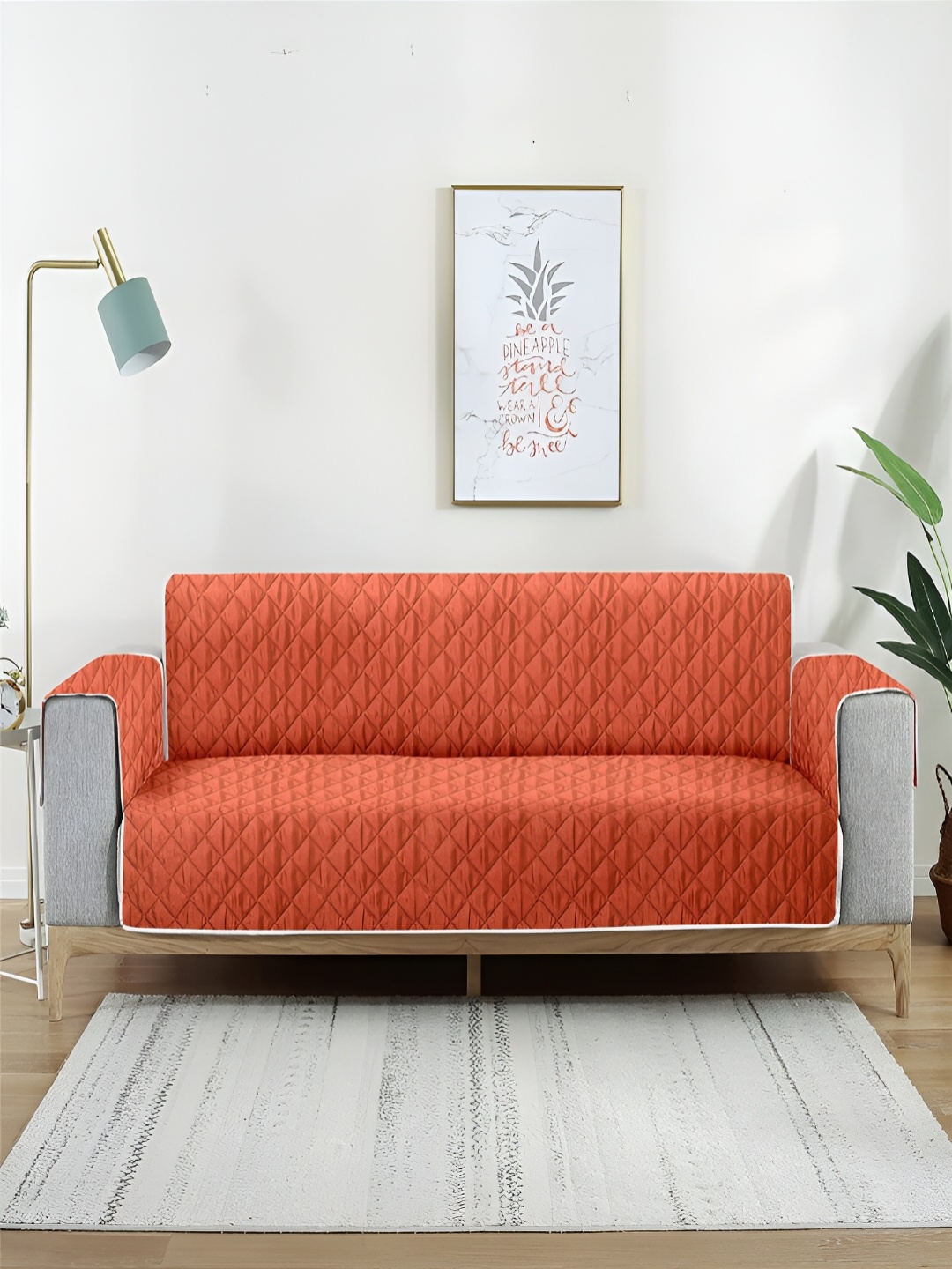 

Aura Brown & Orange Self Design Reversible Quilted Polyester Two Seater Sofa Cover