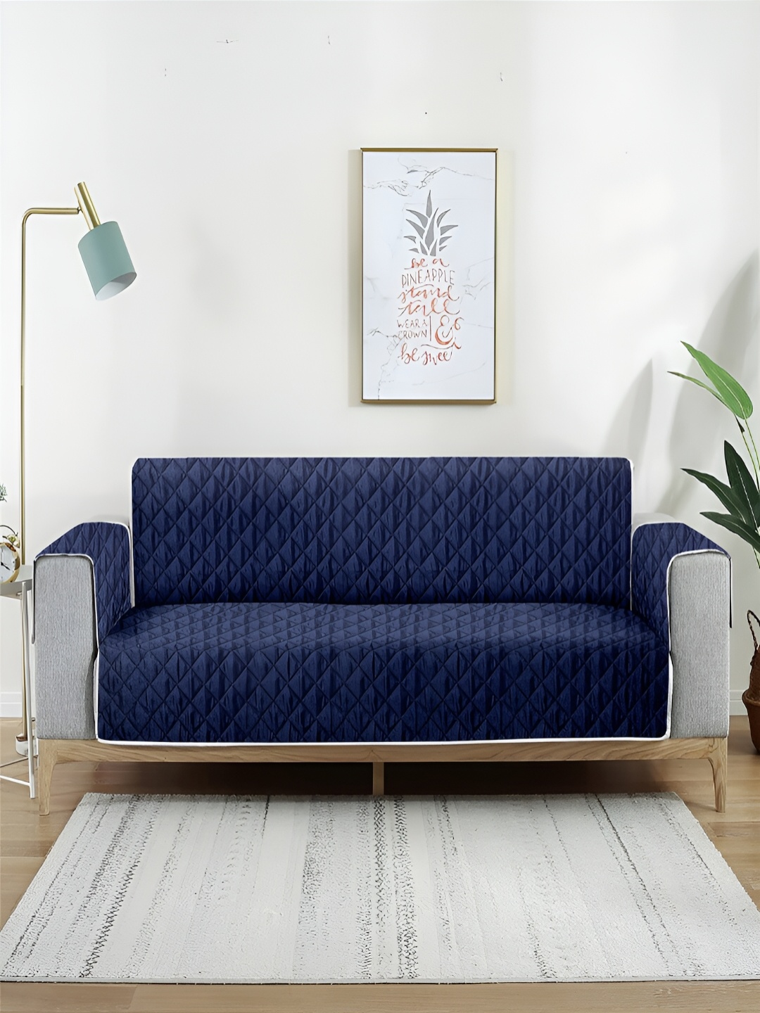 

Aura Brown & Navy Blue Reversible Quilted Two Seater Sofa Cover