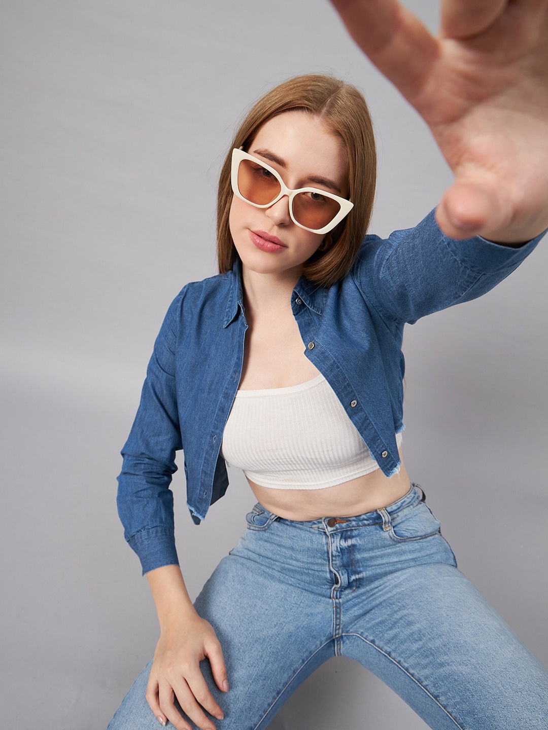 

Orchid Blues Spread Collar Long Sleeves Chest Pocket Asymmetric Hemline Crop Denim Shirt, Blue