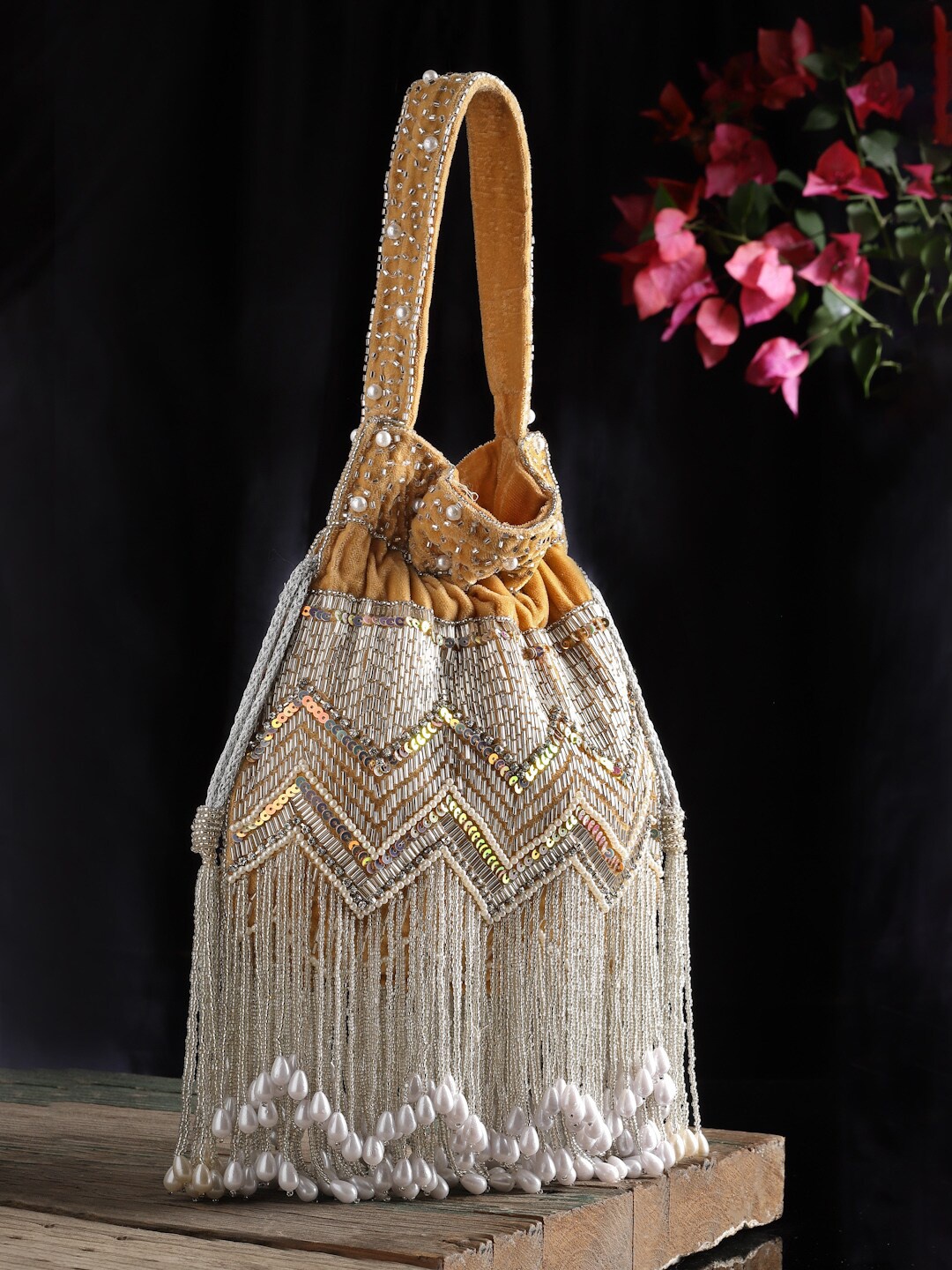 

Anekaant Embroidered Tasselled Potli, Beige