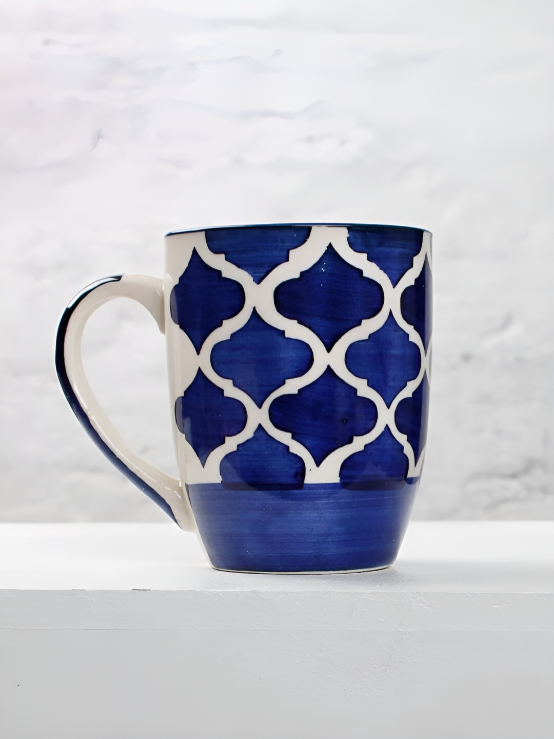 

The Earth Store Blue & White Printed Microwave Safe Glossy Finish Ceramic Mug 280 ml