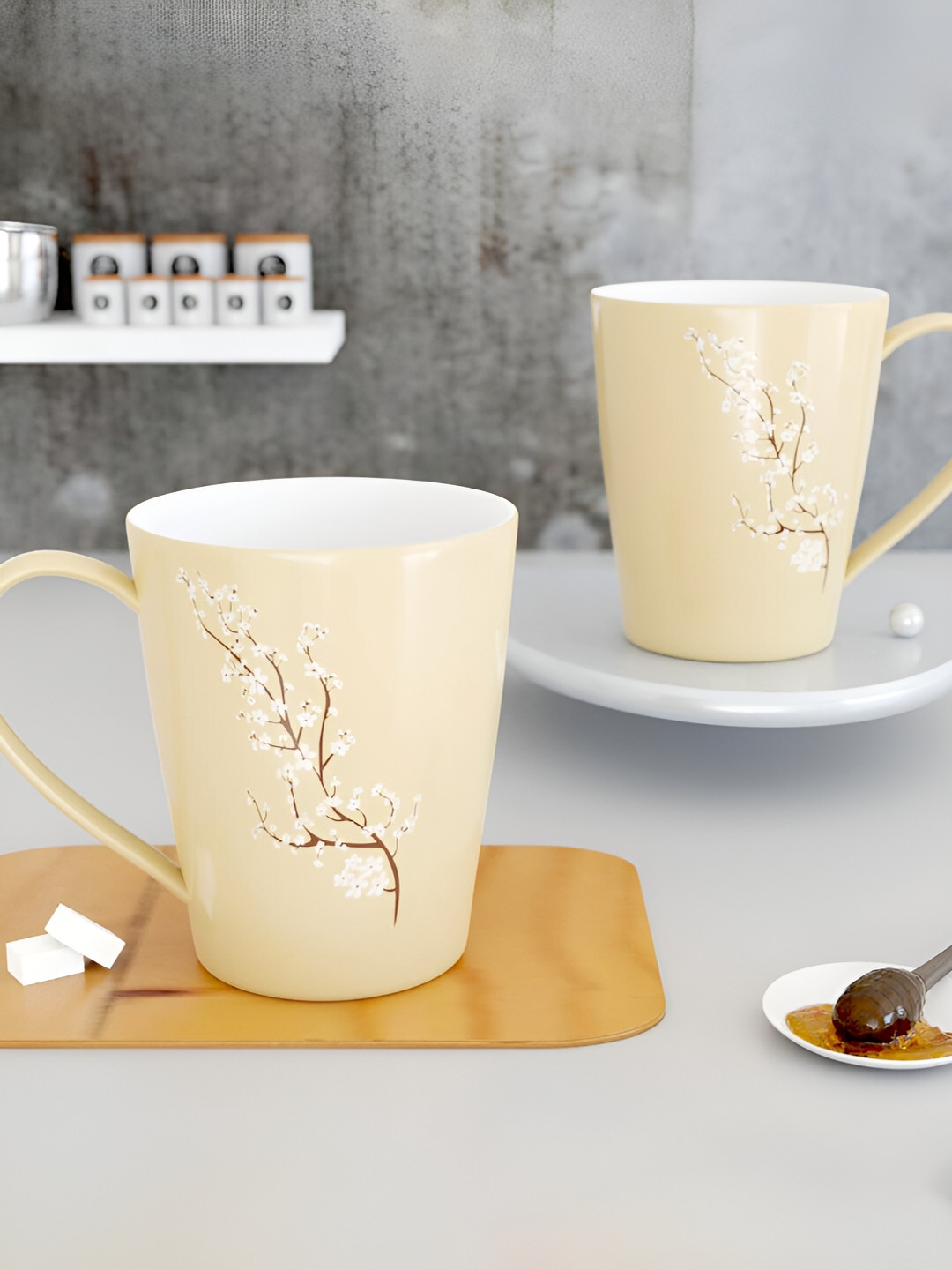 

The Earth Store Cream 2 Pcs Printed Microwave Safe Glossy Finish Ceramic Mugs 330 ml Each