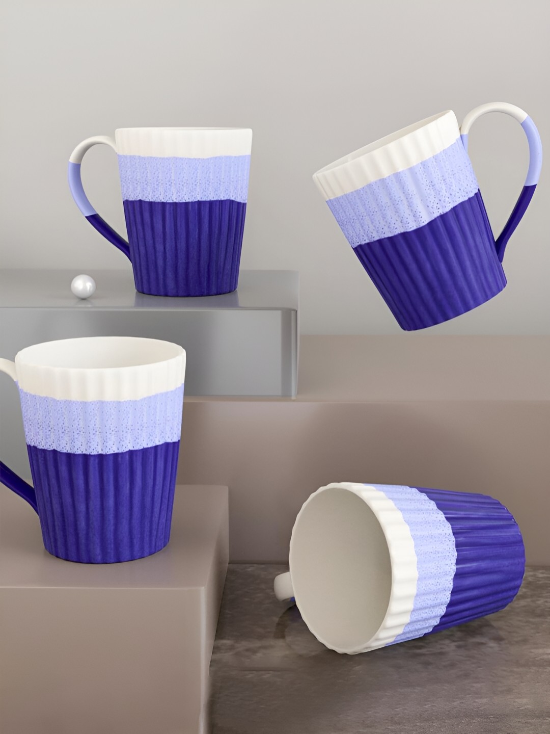 

The Earth Store Meld Dual Tone Blue & White Printed Ceramic Matte Mugs Set 330 ml Each