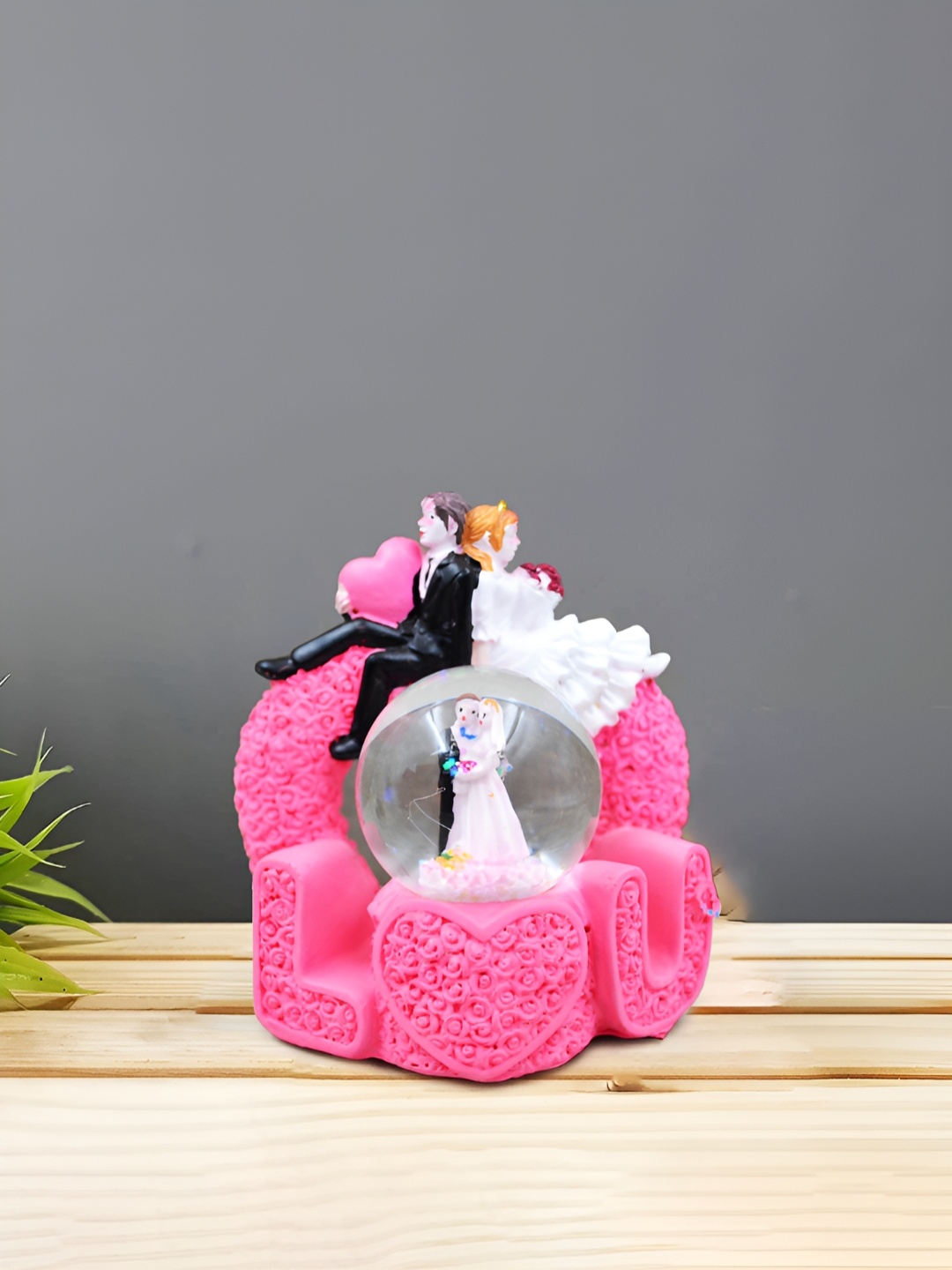 

CraftVatika Pink and Black Small Figurine Showpiece