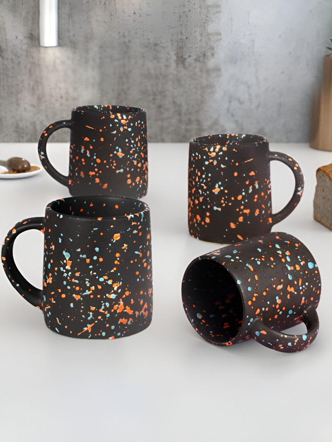 

The Earth Store Black & Orange 4 Pcs Handcrafted Printed Ceramic Matte Mugs 320 ml
