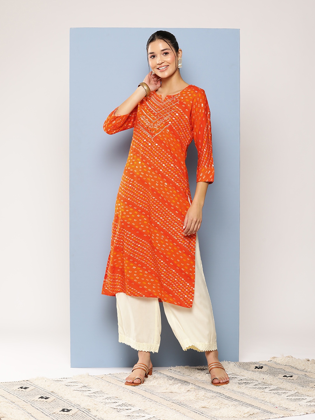 

Aarika Women Printed Thread Work Kurta, Orange