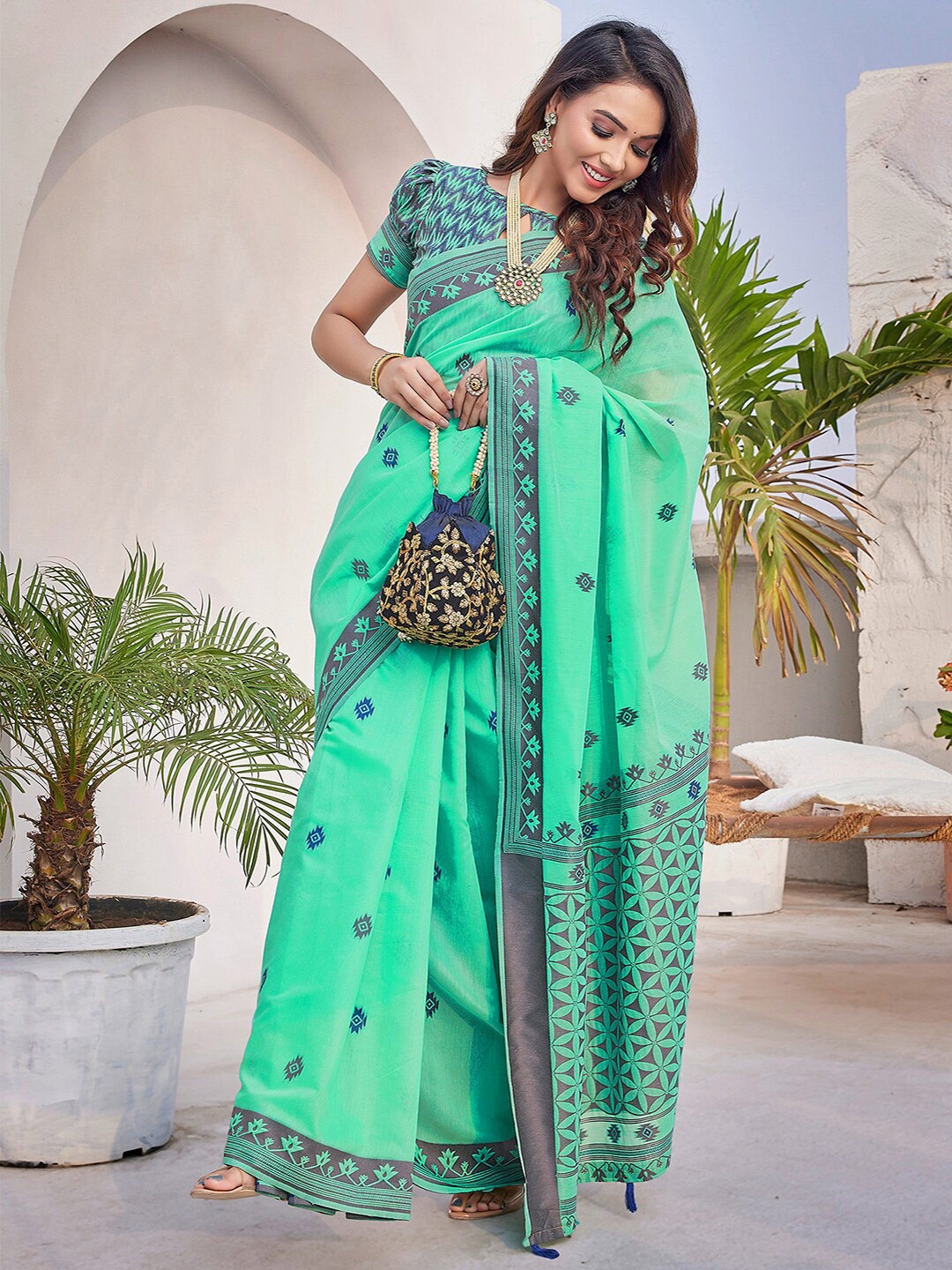 

Mitera Turquoise Blue Floral Woven Design Silk Cotton Banarasi Saree