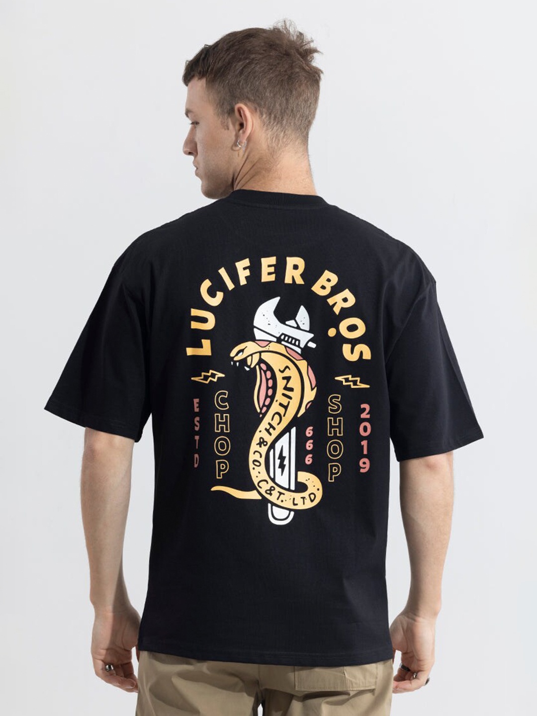 

Snitch Black Typography Printed Drop-Shoulder Sleeves Oversized Cotton T-shirt