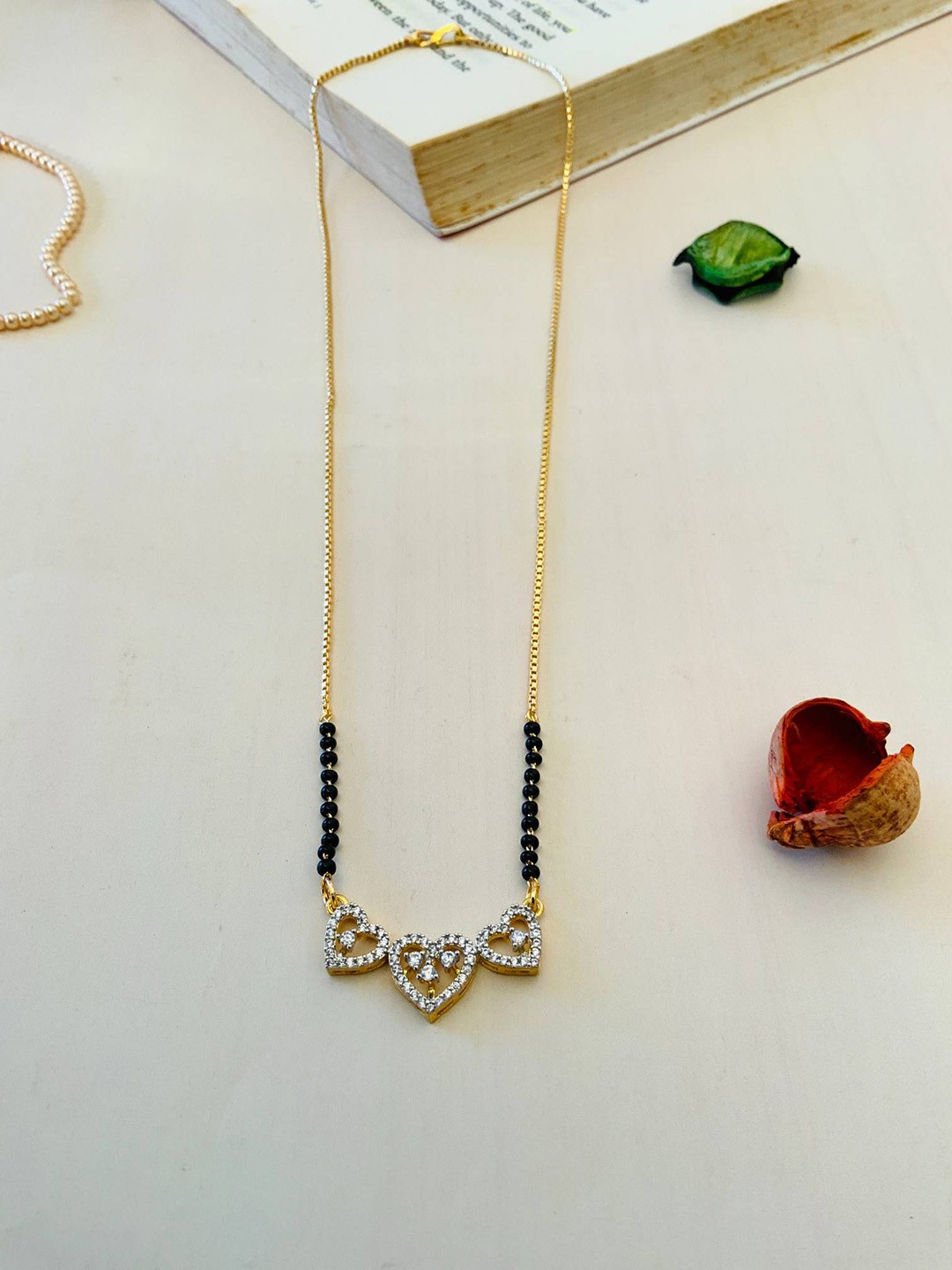 

ABDESIGNS Gold-Plated American Diamond Stones Studded and Beaded Mangalsutra