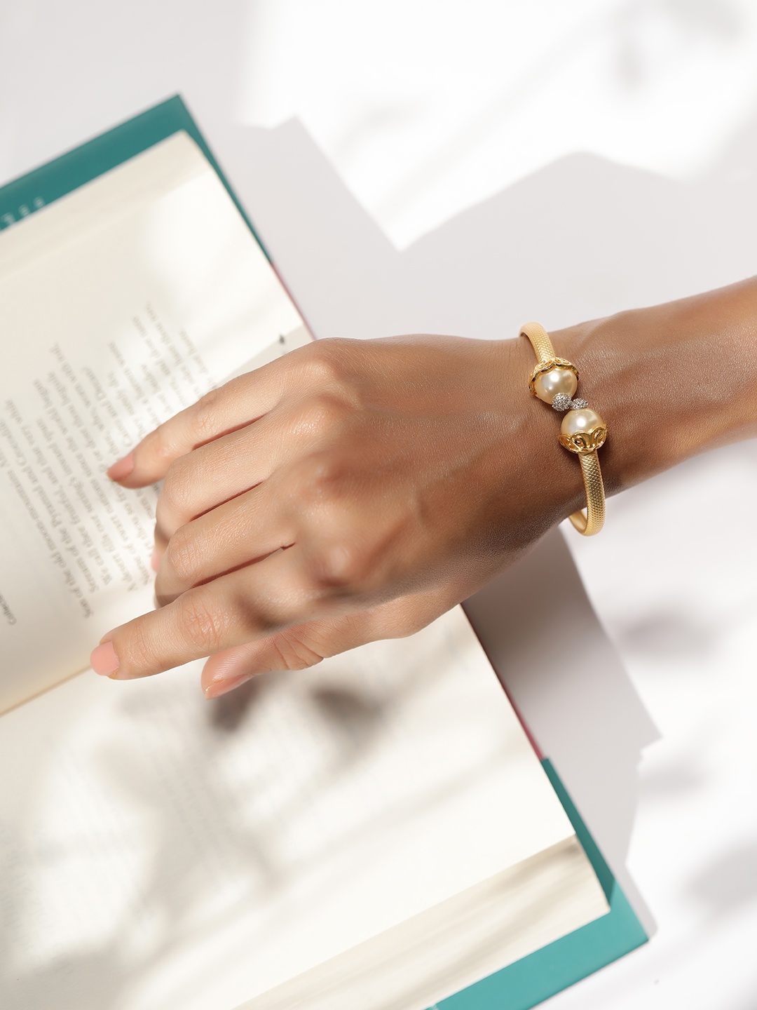 

Rubans 18K Gold Plated Stylish Open Ended Pearl & CZ Studded Bangle Bracelet