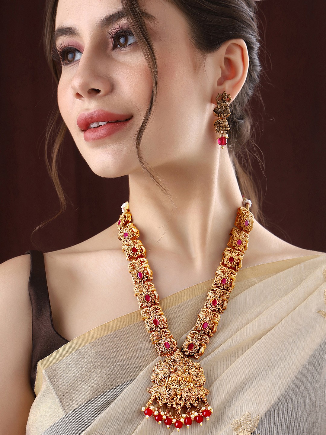 

Priyaasi Gold Plated Stones Studded Temple Necklace With Earrings