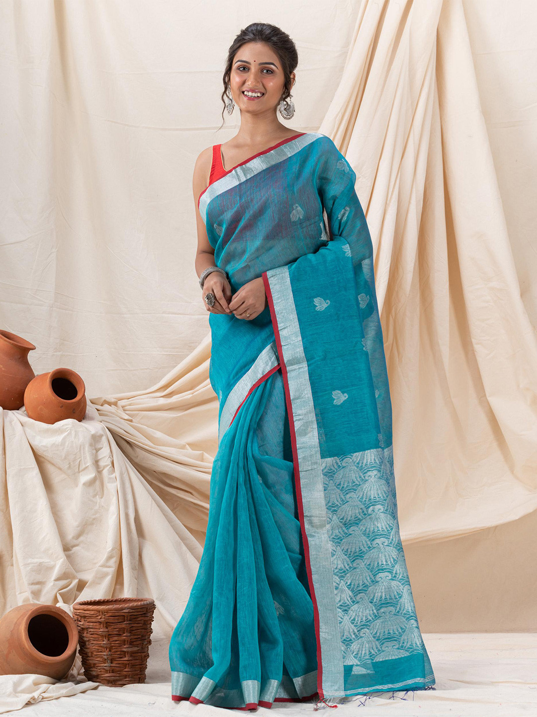 

Angoshobha Woven Design Zari Linen Blend Saree, Blue