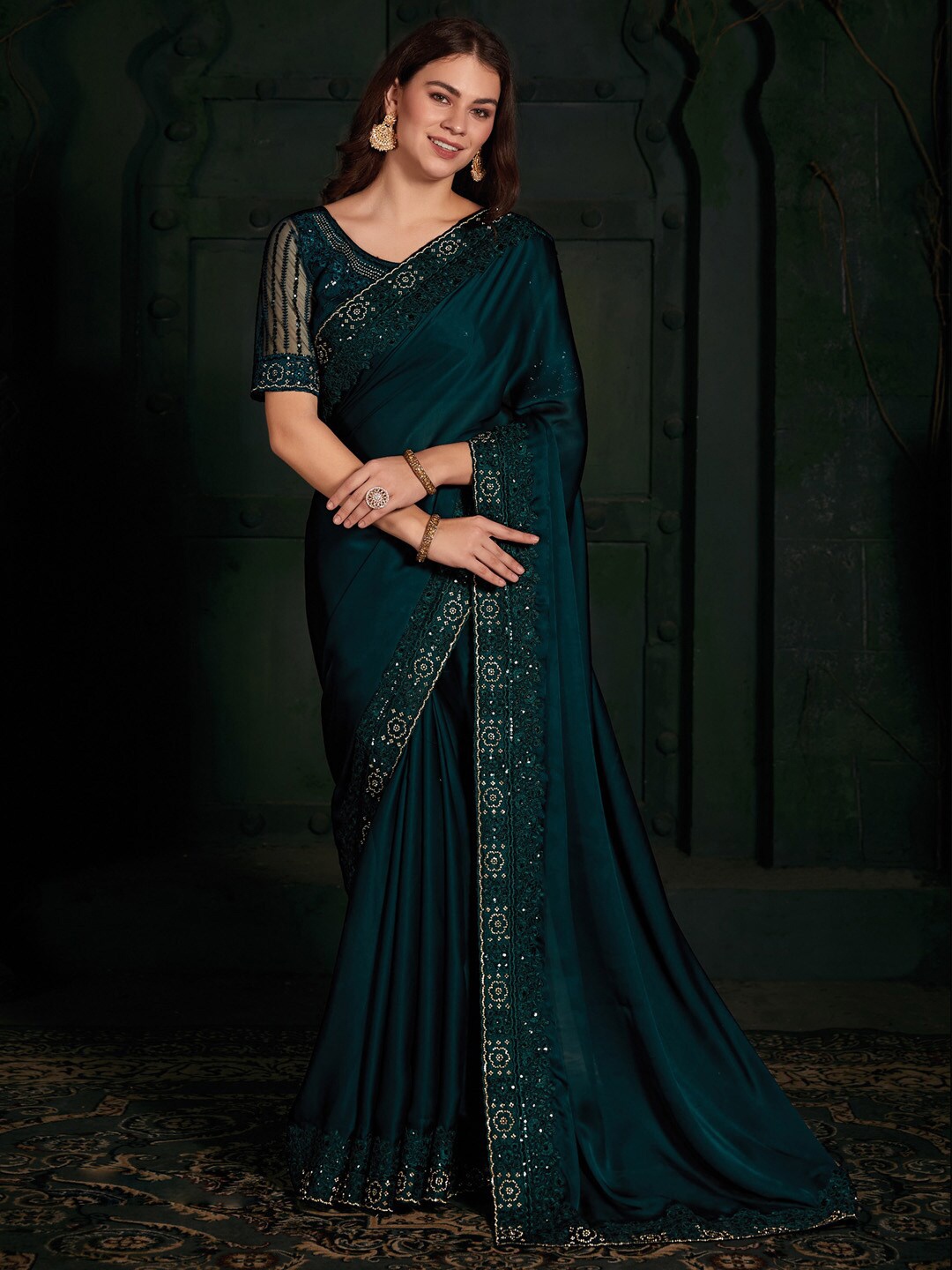 

Saree mall Ethnic Motifs Embellished Beads and Stones Satin Saree, Teal