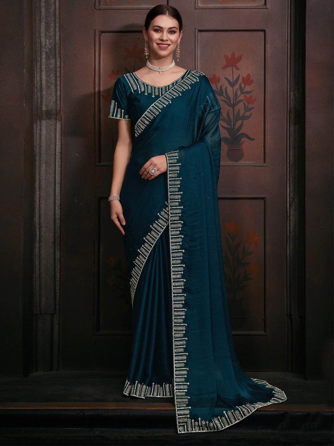

Saree mall Teal Embellished Beads and Stones Pure Chiffon Saree