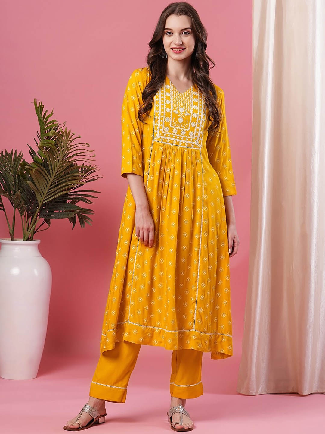 

Globus Yellow Ethnic Motifs Printed Empire Thread Work Kurta with Trousers