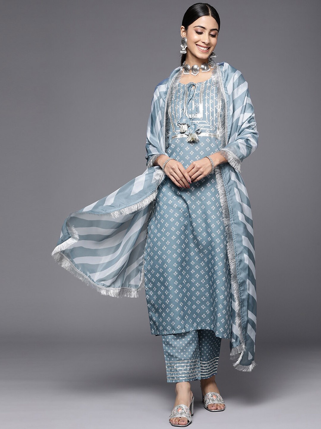 

KALINI Bandhani Printed Tie Up Neck Sequinned Kurta with Trousers & Dupatta, Grey