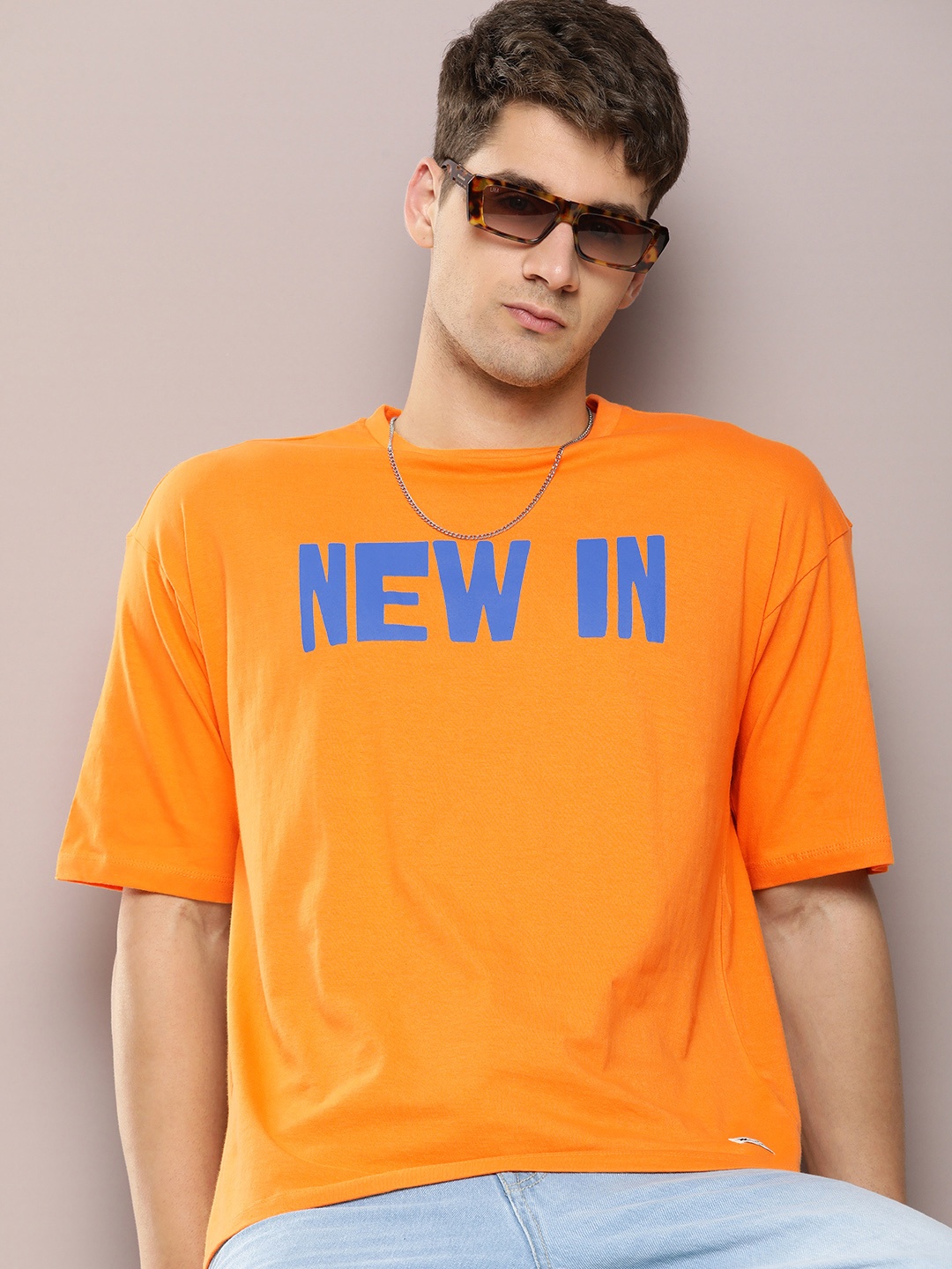 

Kook N Keech Men Typography Printed Drop-Shoulder Sleeves Pure Cotton Oversized T-shirt, Orange