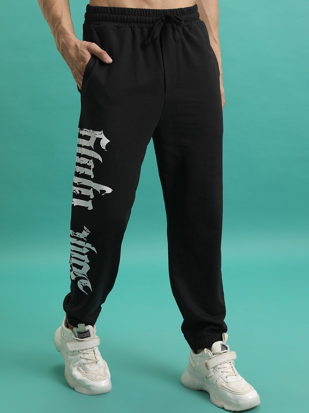 

HIGHLANDER Men Typography Printed Relaxed Fit Knitted Joggers Trousers, Black