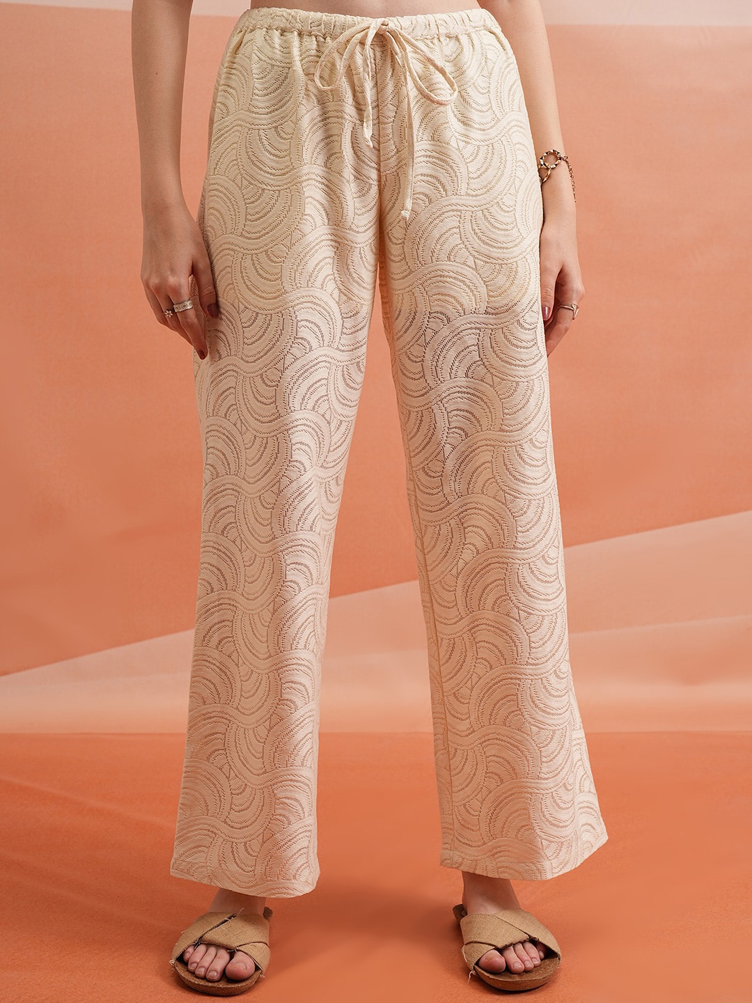 

Tokyo Talkies Women Off White Self Design Flared Parallel Trousers