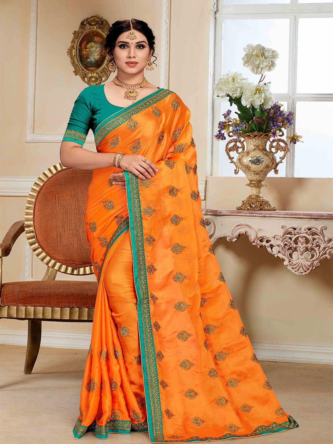 

Mitera Orange Ethnic Motifs Embroidered Saree