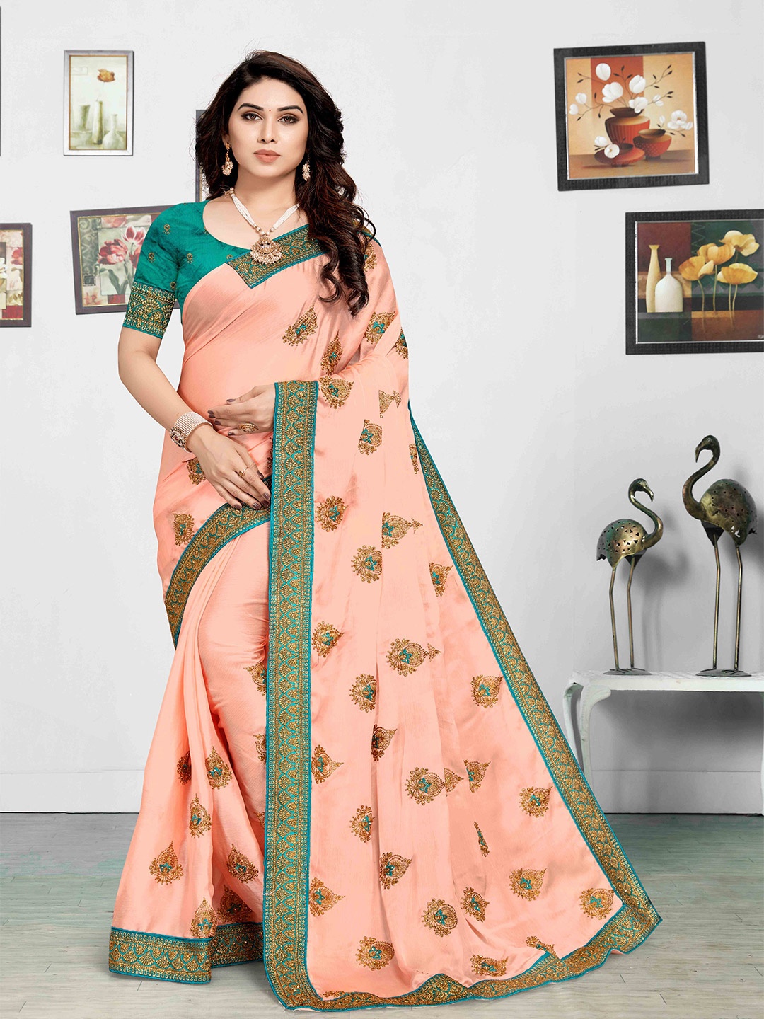

Mitera Peach Coloured Ethnic Motifs Embroidered Saree