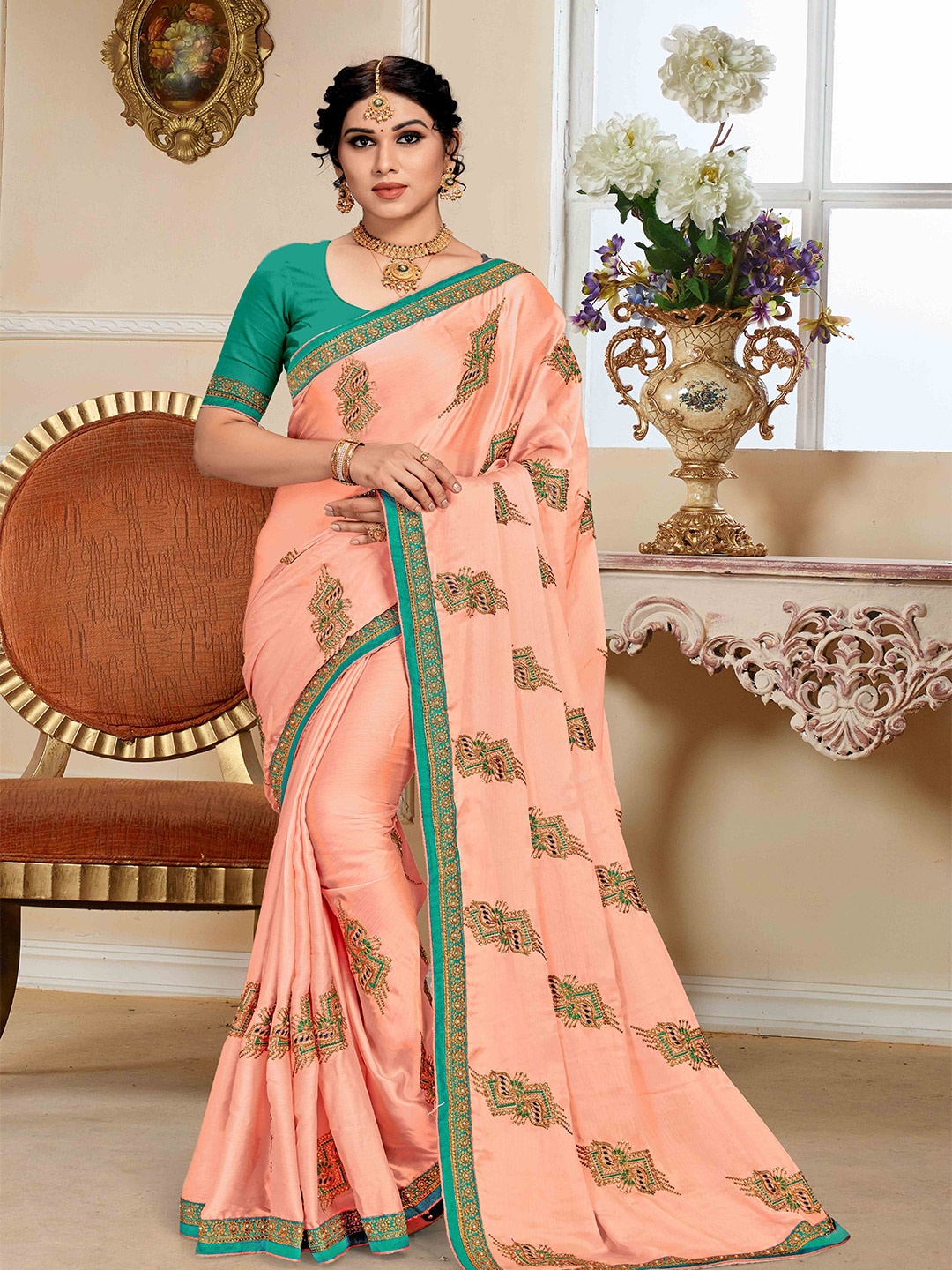 

Mitera Peach Coloured Ethnic Motifs Embroidered Saree