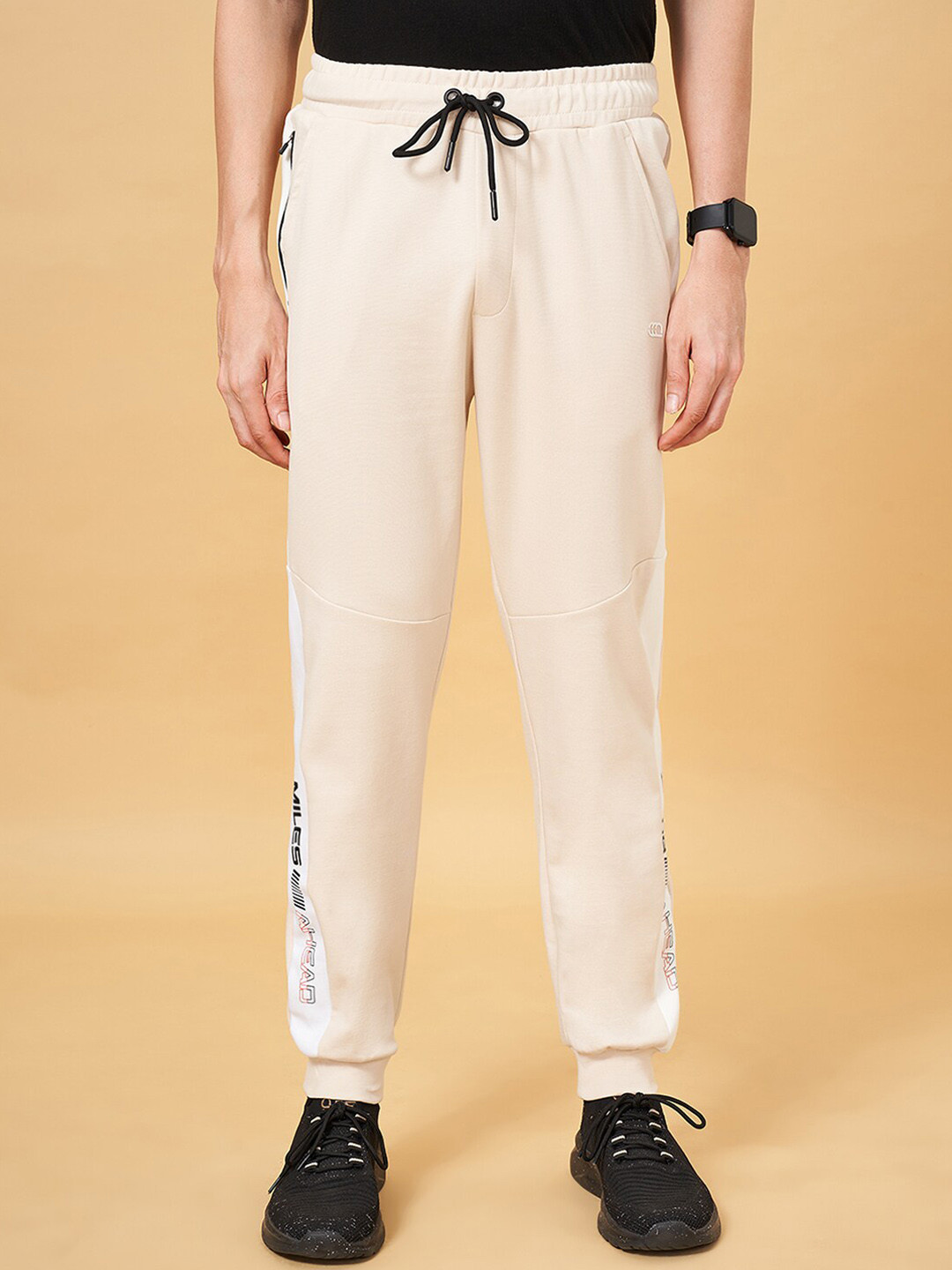 

Ajile by Pantaloons Men Typography Printed Mid-Rise Joggers, Beige