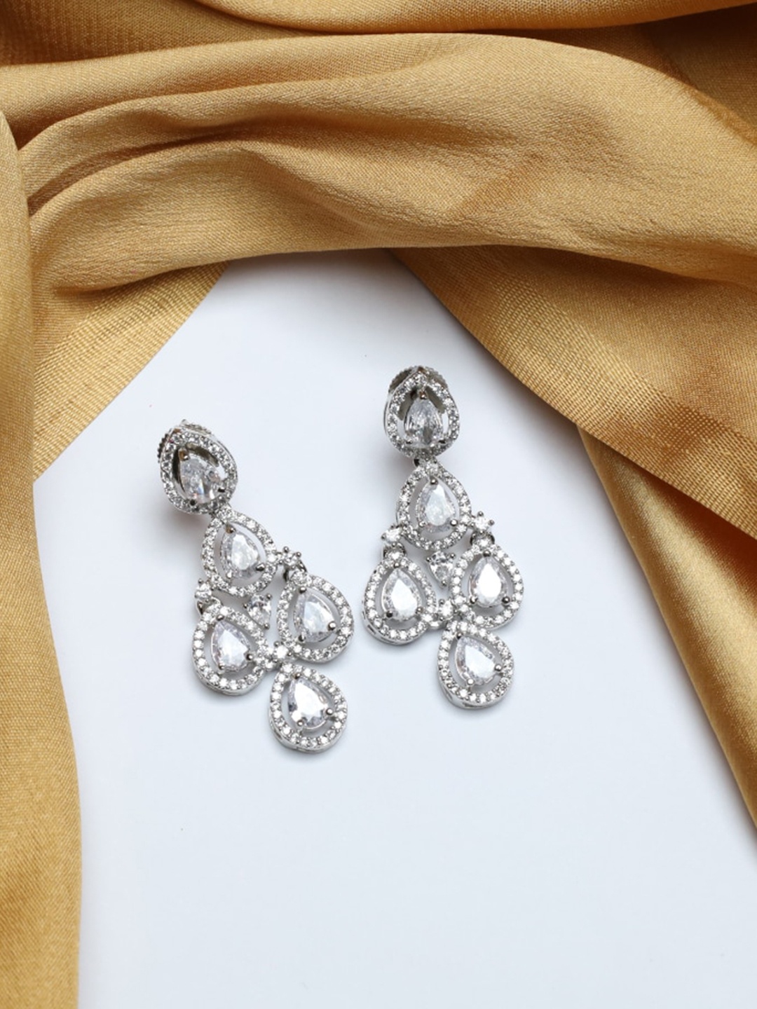 

Maansh Sterling Silver-Plated American Diamond Studded Contemporary Drop Earrings