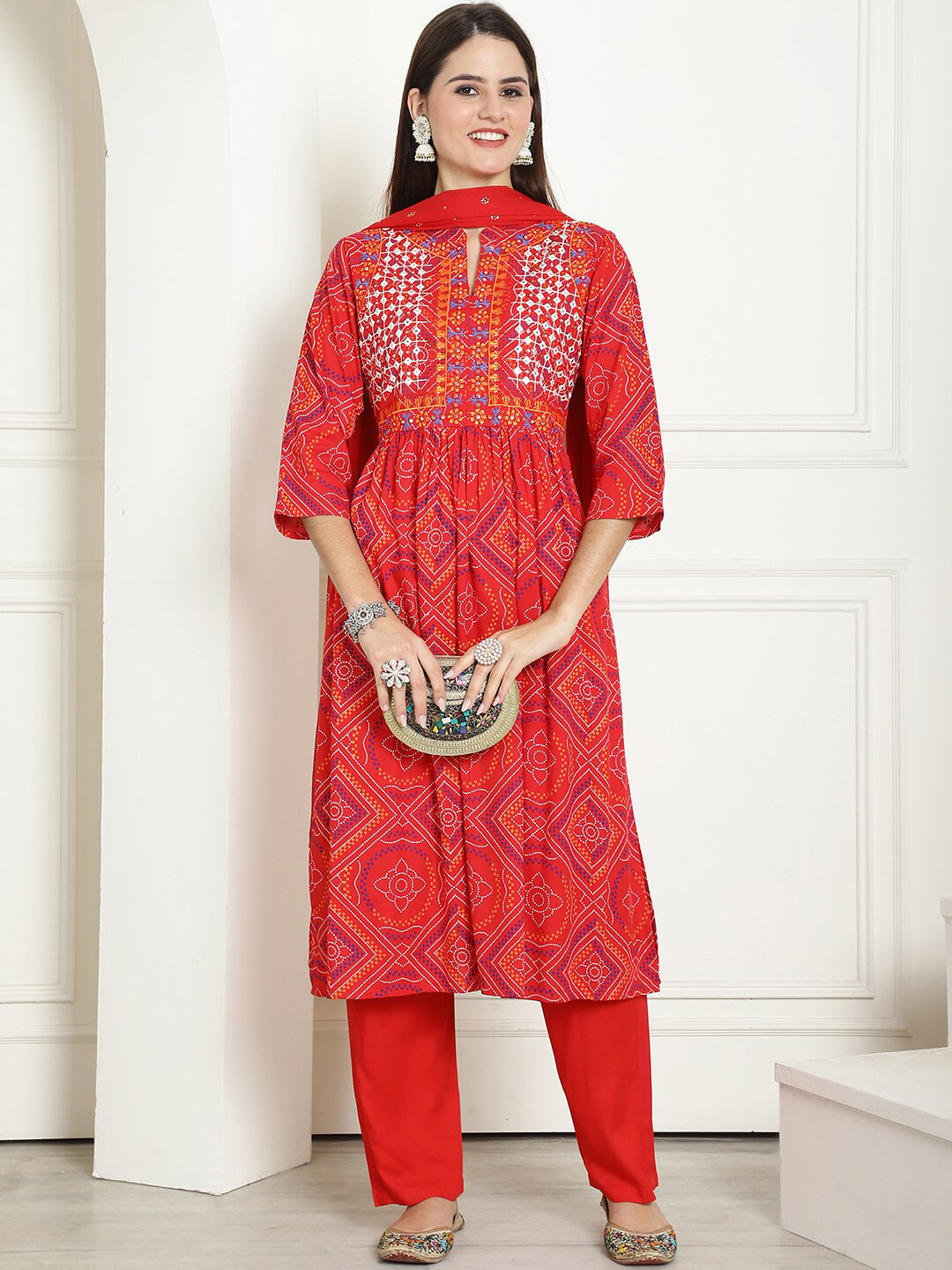 

KALINI Bandhani Printed Mirror Work Mandarin Collar Pleated Kurta With Trouser & Dupatta, Red