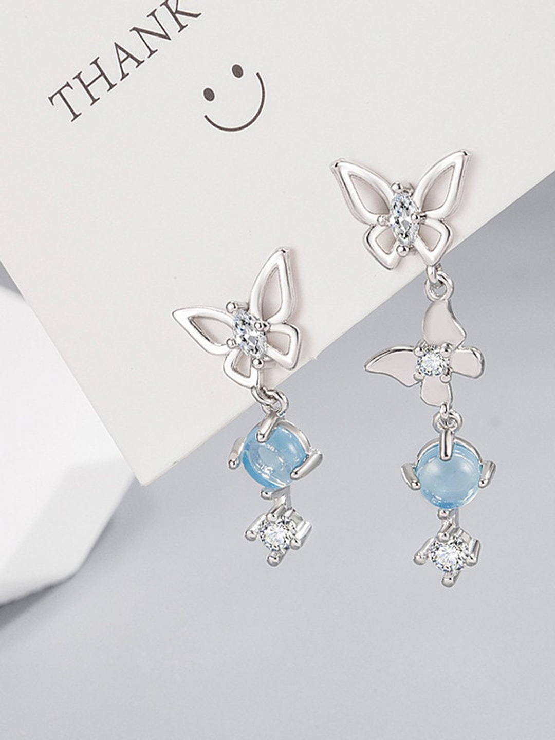 

MYKI Stainless Steel Silver-Plated CZ Studded Asymmetrical Butterfly Drop Earrings