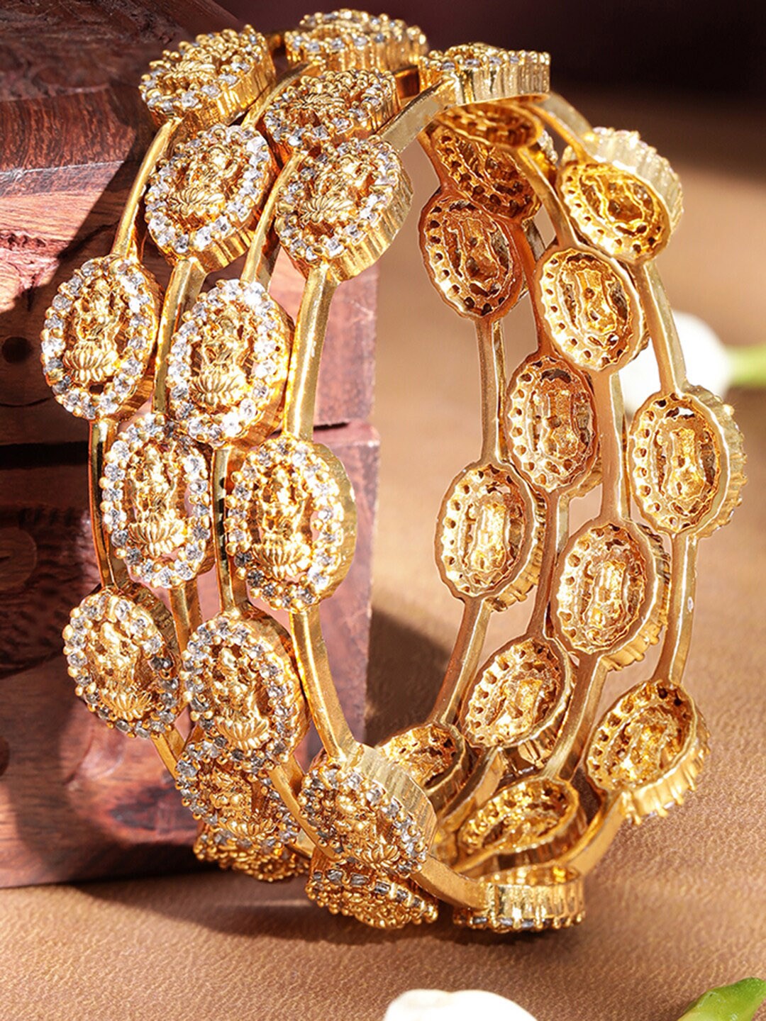 

Rubans Set Of 4 Gold Plated American Diamond Temple Bangles