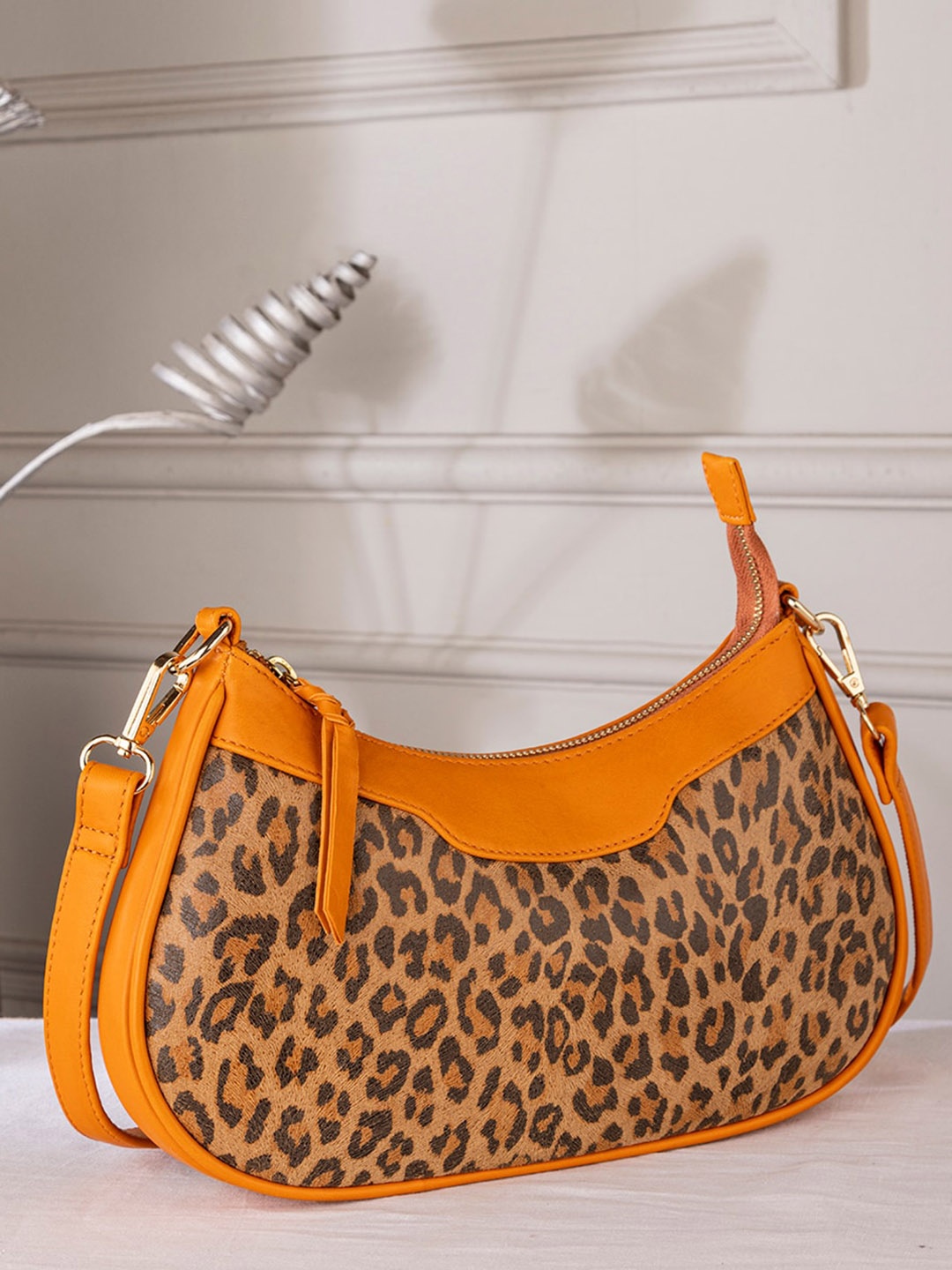 

Abelardo De Moda Animal Printed Leather Half Moon Sling Bag, Orange