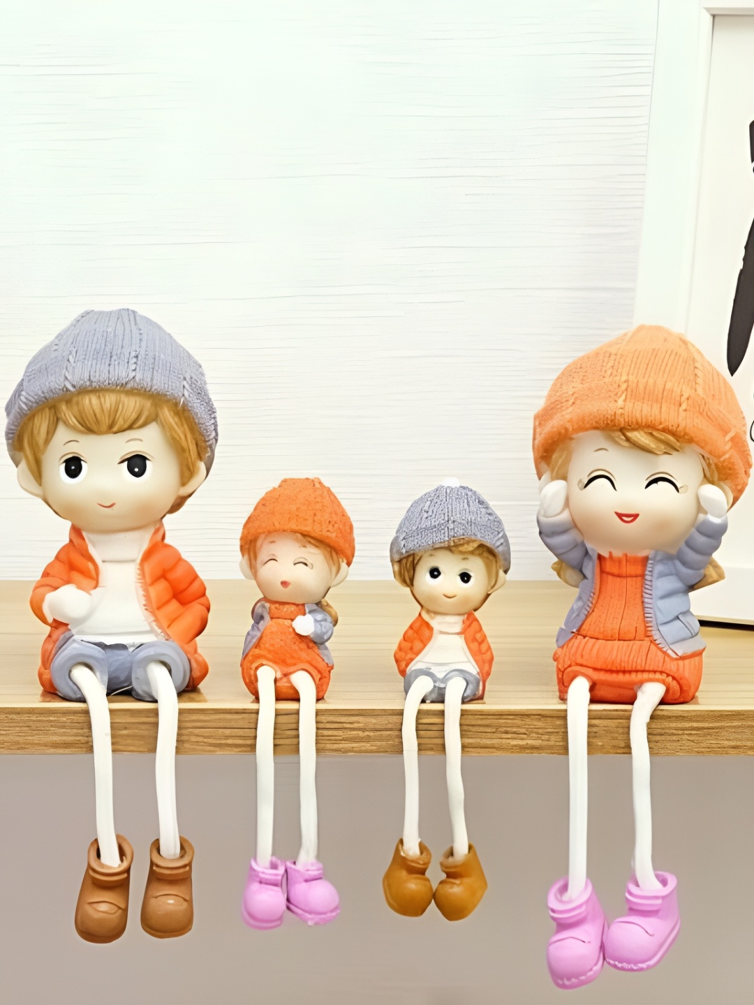 

Satyam Kraft Orange & Grey 4 Pieces Hanging Legs Cute Boy and Girl Toy Figurine Showpieces