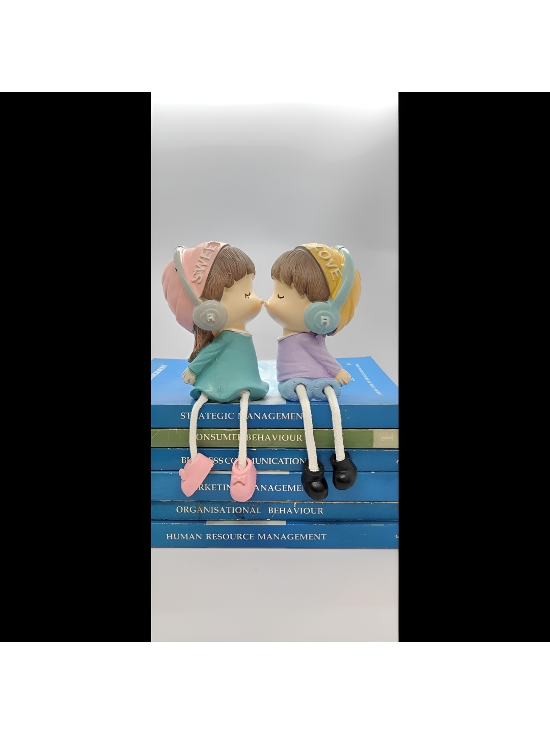 

Satyam Kraft Yellow & Pink 2 Pieces Hanging Legs Cute Boy and Girl Toy Figurine Showpieces