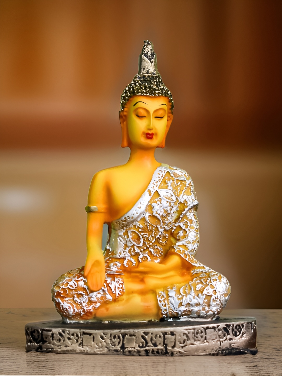 

The Earth Store Yellow & Orange Buddha Idol Showpiece