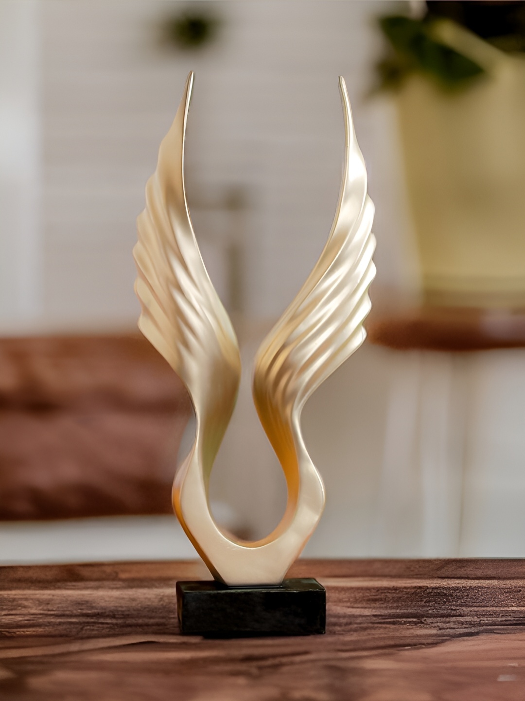 

The Earth Store Gold-Toned Figurine Showpiece