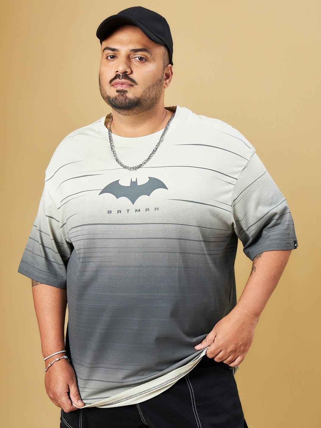 

Bewakoof Plus Size Batman Printed Drop-Shoulder Sleeves Oversized Cotton T-shirt, Beige