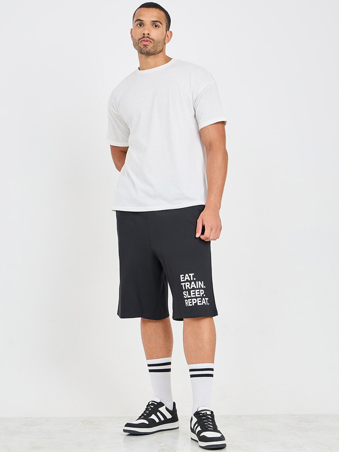 

Styli Black Men Mid-Rise Typography Printed Oversized Loose Fit Shorts