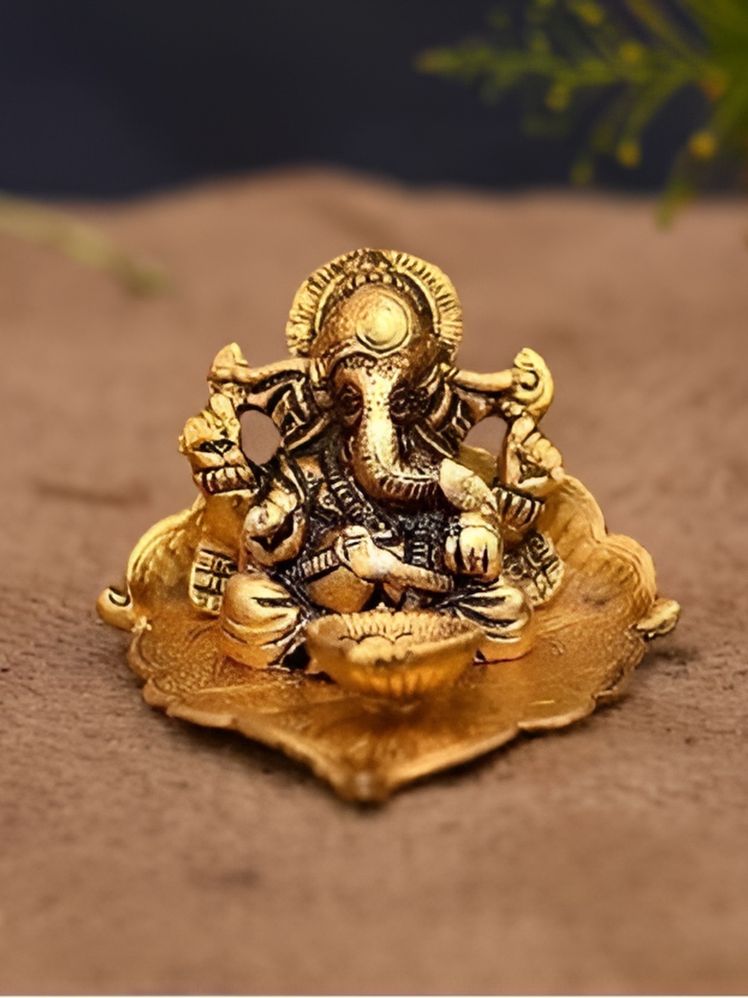 

Navyaksh Gold-Toned Metal Ganesh Showpiece