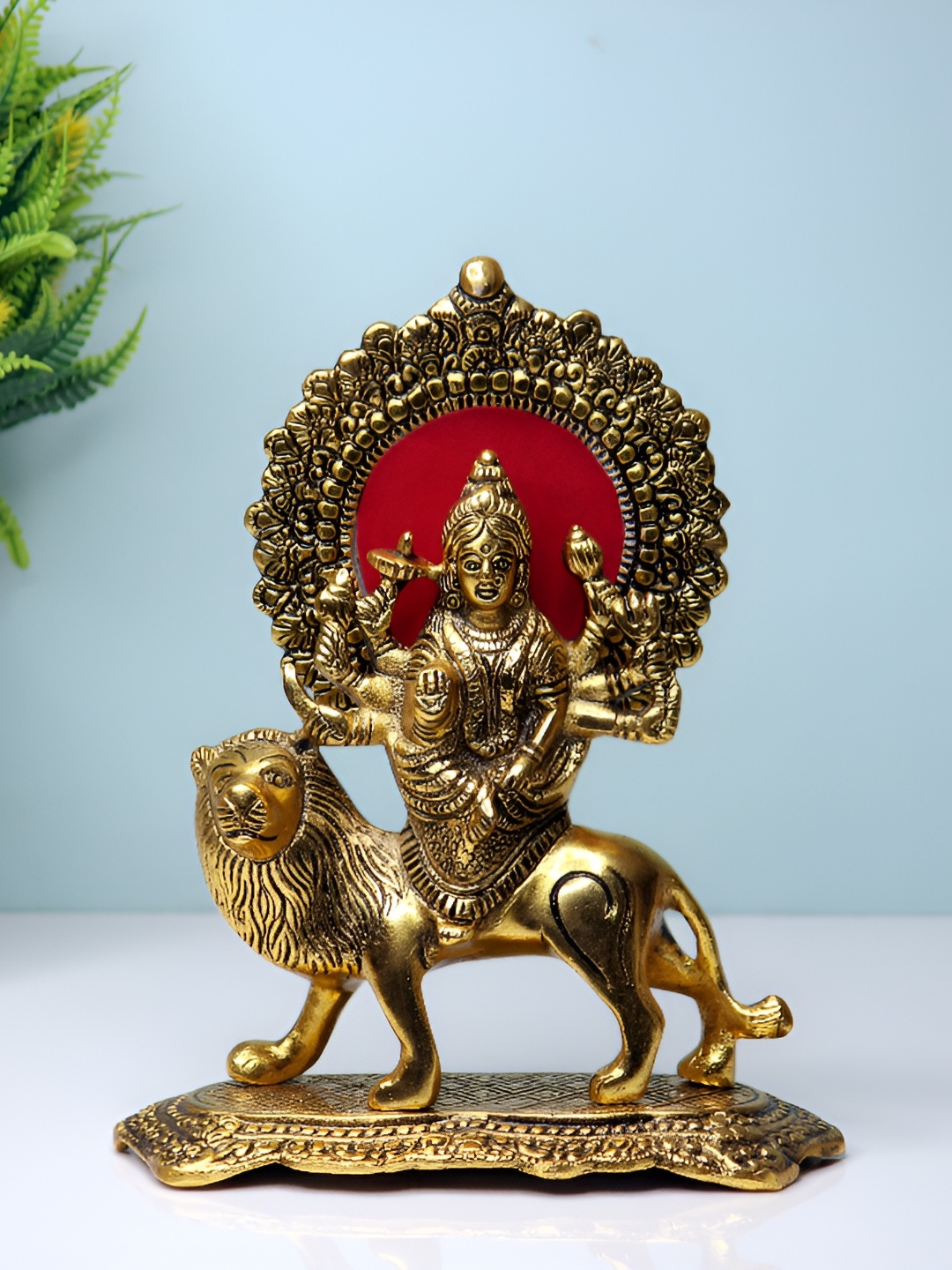 

Navyaksh Gold Toned Religious Showpiece