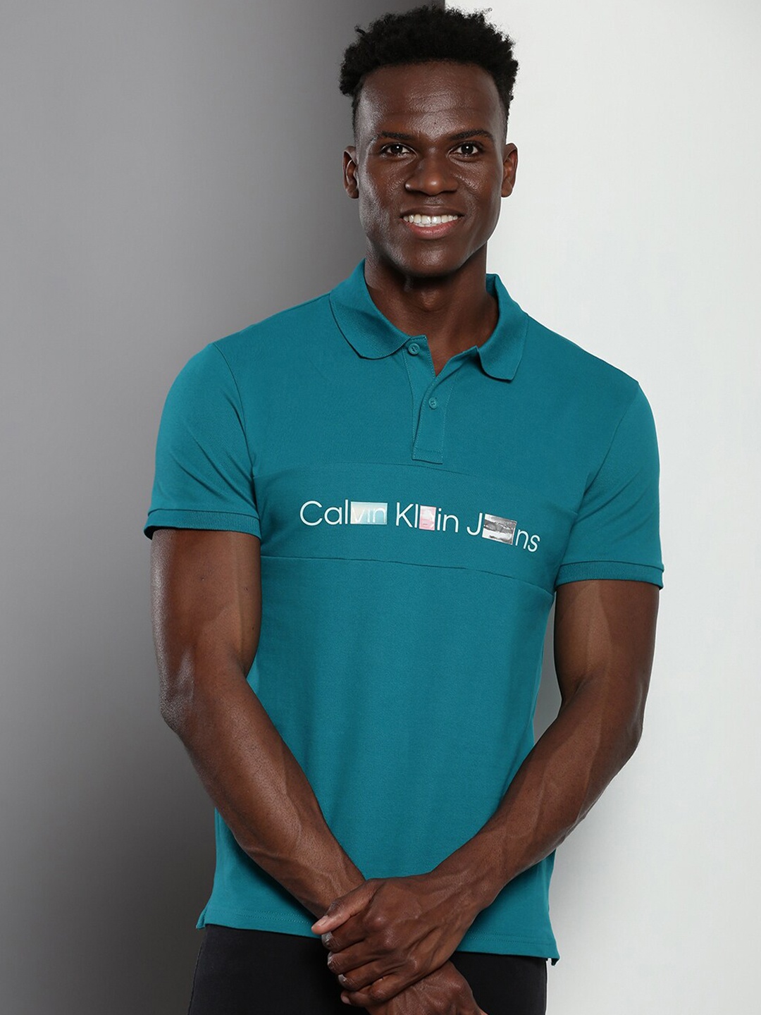 

Calvin Klein Typography Printed Polo Collar Slim Fit T-shirt, Teal