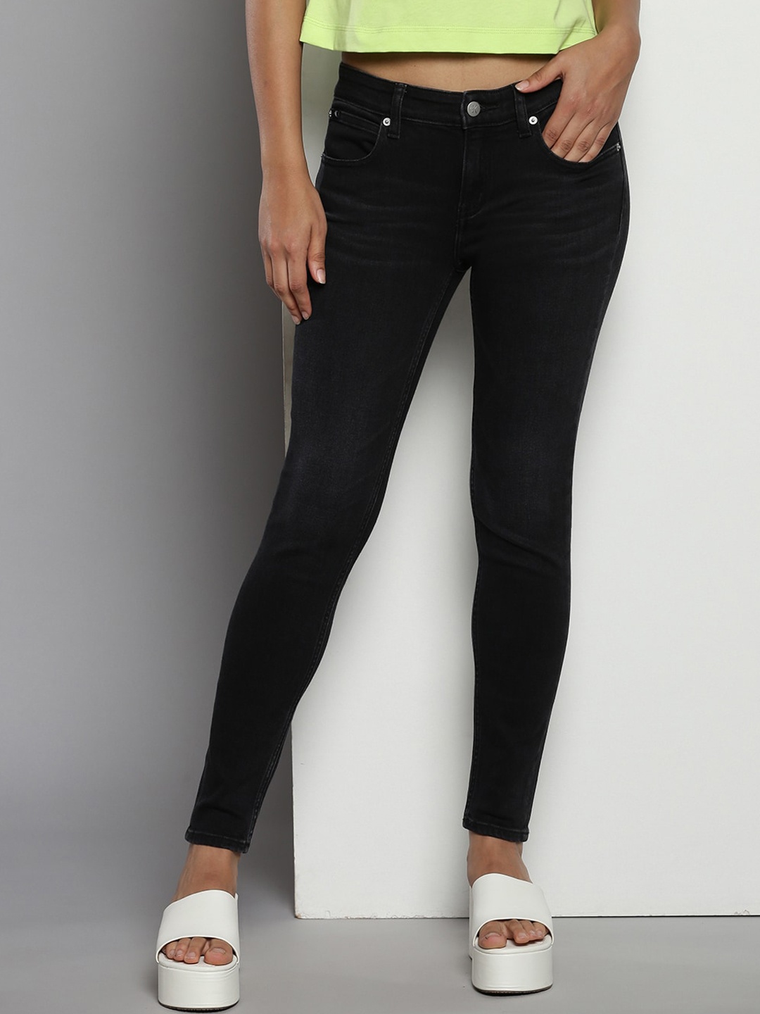 

Calvin Klein Women Clean Look Mid-Rise Stretchable Jeans, Black